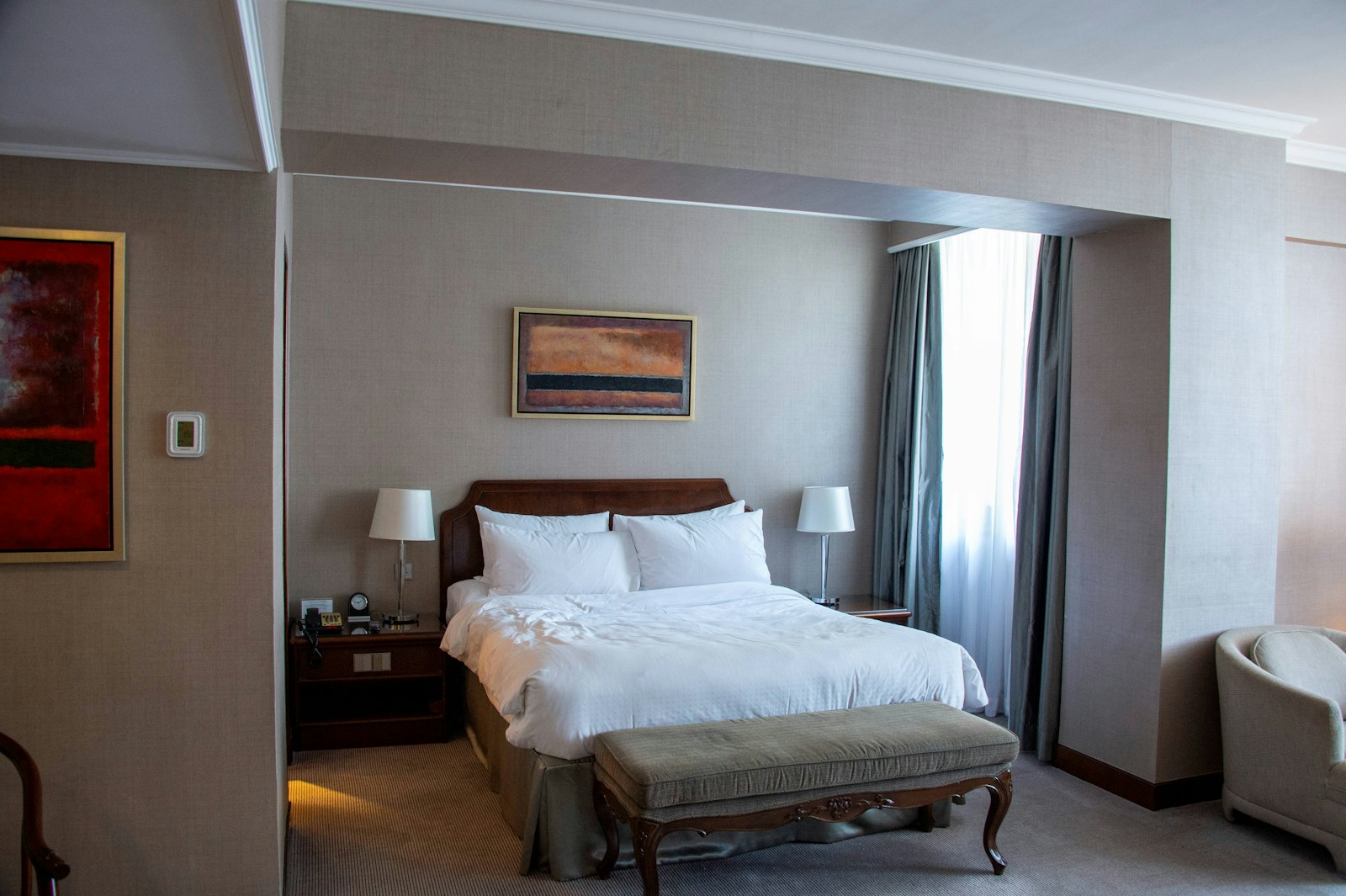 A white bedroom in a hotel